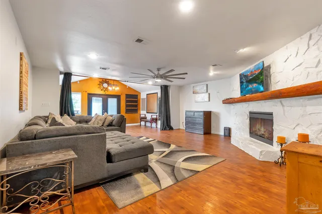 a living room with furniture and a clock