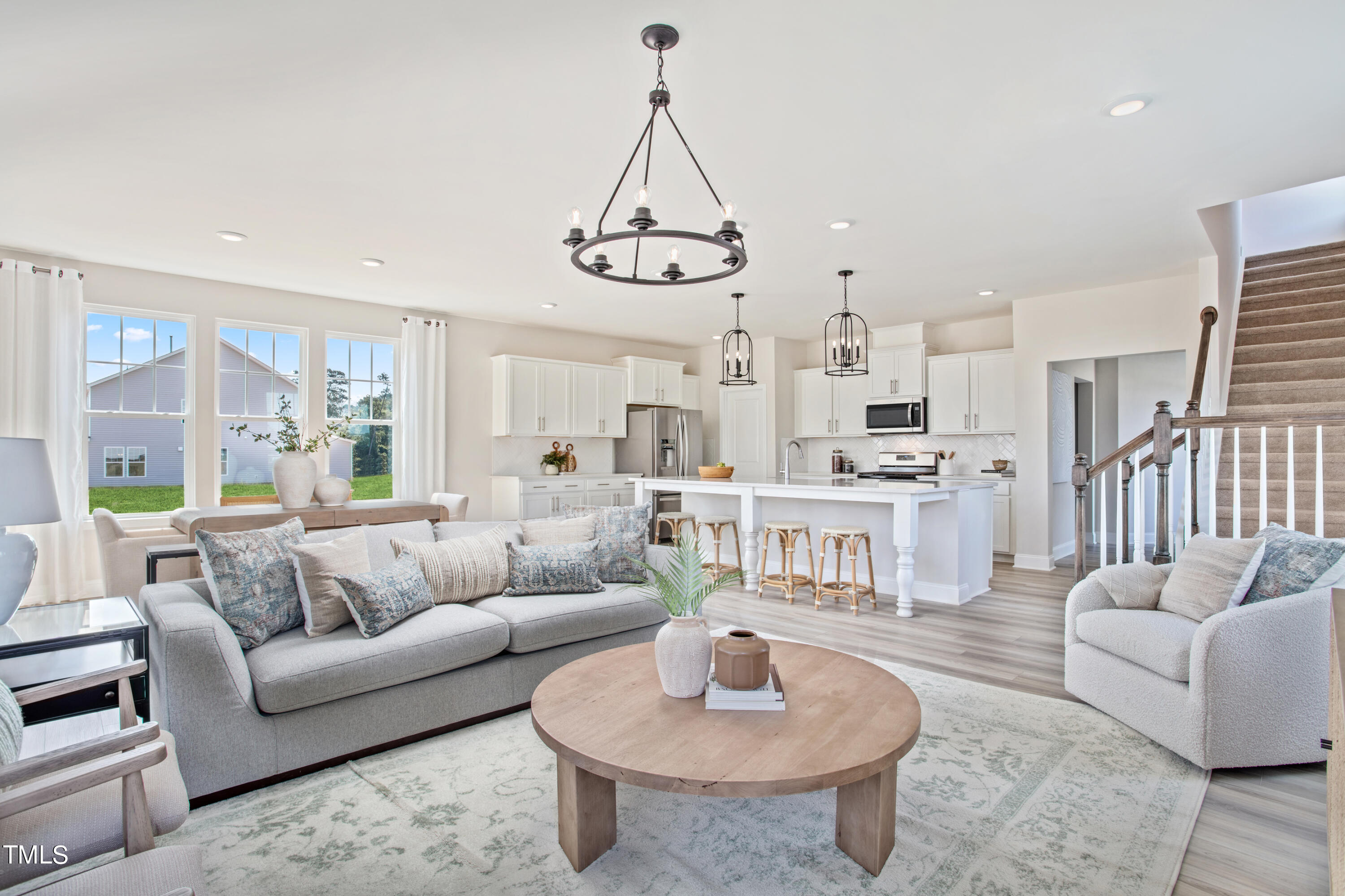 4940 Ranger Grv Way Raleigh, NC 27604 - Photo 2 of 6 a living room with furniture or kitchen view and a wooden floor