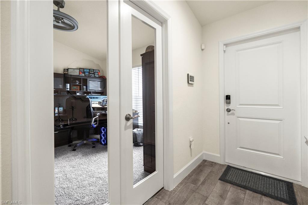 2512 20th Street Southwest Lehigh Acres, FL 33976 - Photo 11 of 48 a view of a bedroom bathroom and front door