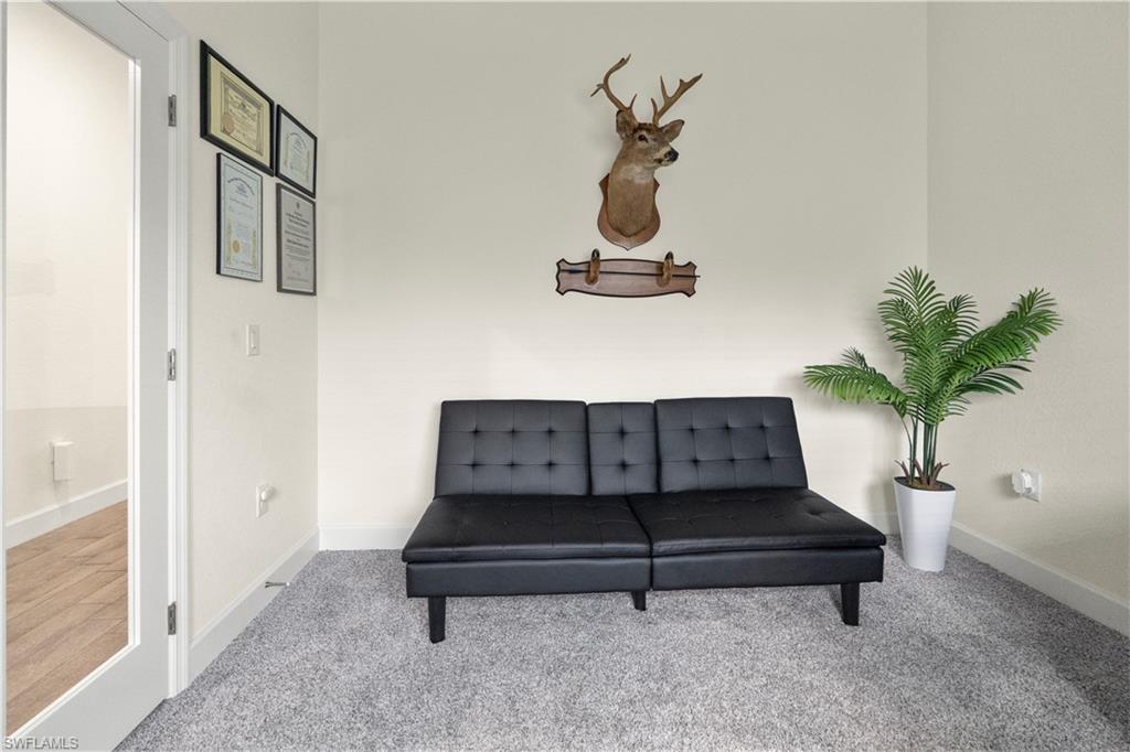 2512 20th Street Southwest Lehigh Acres, FL 33976 - Photo 13 of 48 a living room with furniture