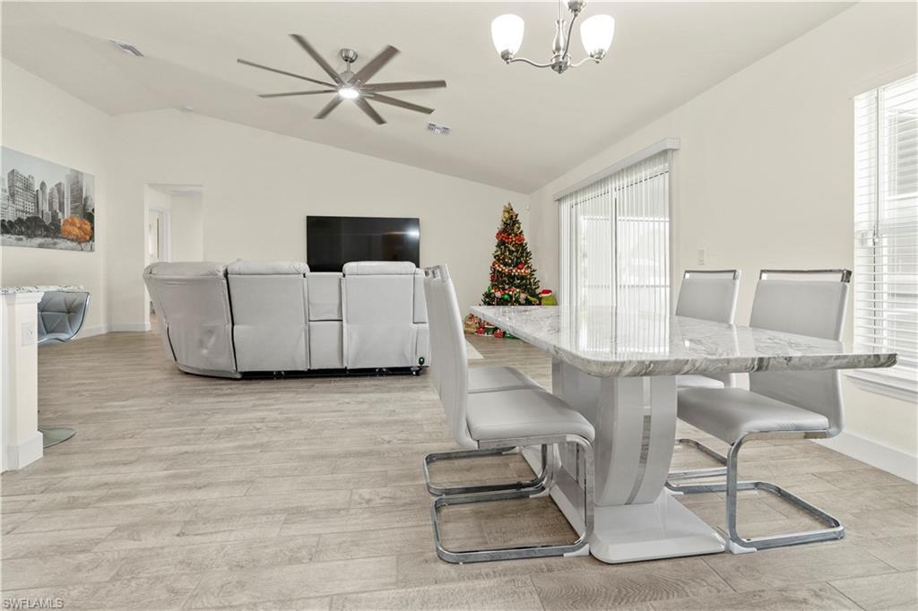 2512 20th Street Southwest Lehigh Acres, FL 33976 - Photo 18 of 48 a living room with furniture and a flat screen tv