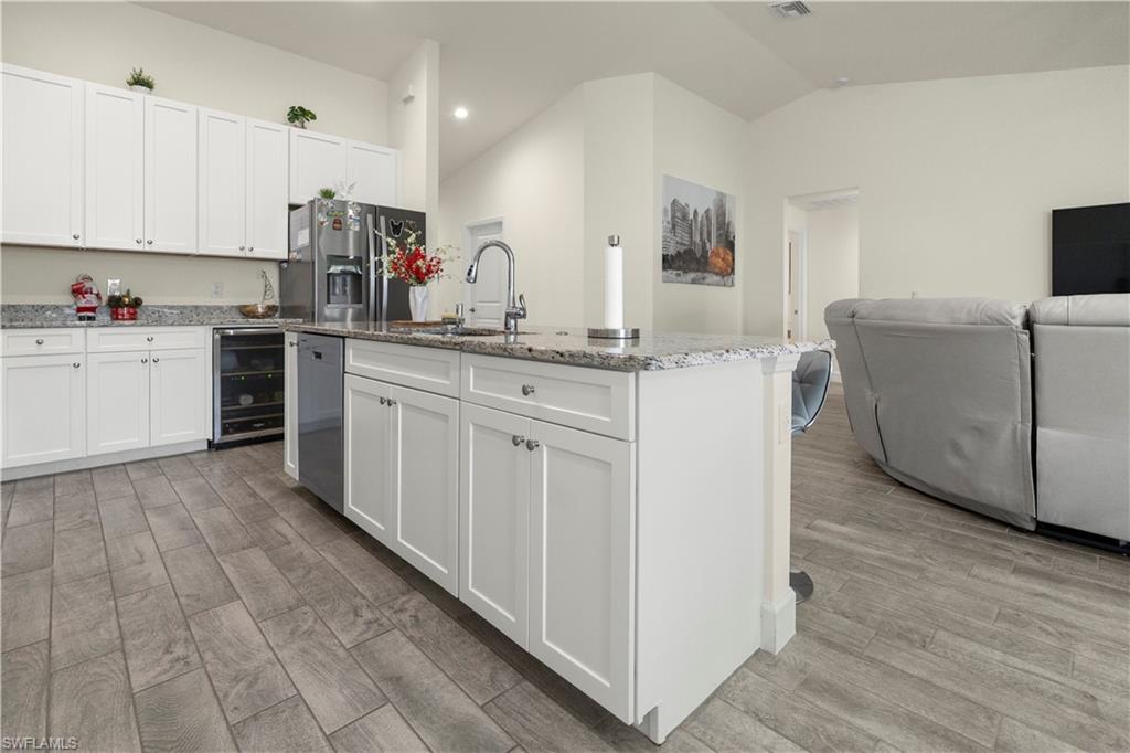 2512 20th Street Southwest Lehigh Acres, FL 33976 - Photo 48 of 48 a kitchen with white cabinets and sink