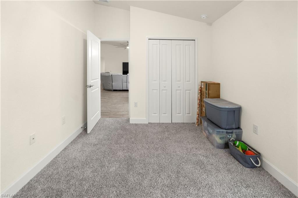 2512 20th Street Southwest Lehigh Acres, FL 33976 - Photo 23 of 48 a view of a livingroom with furniture and toys