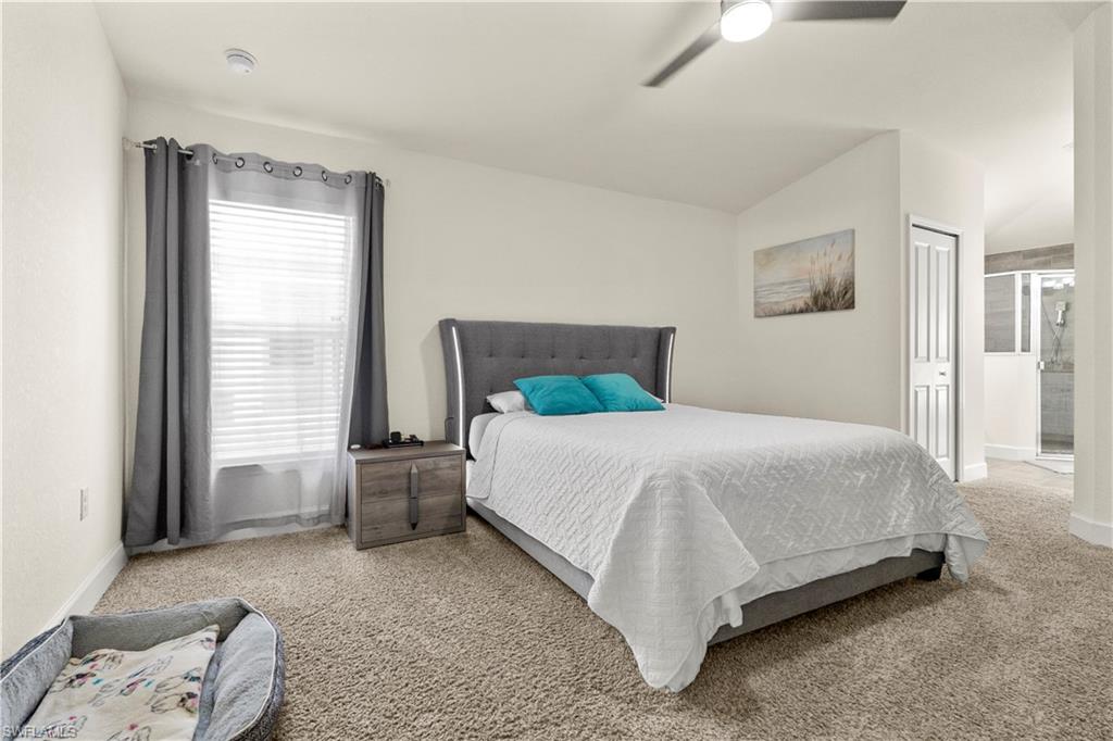 2512 20th Street Southwest Lehigh Acres, FL 33976 - Photo 25 of 48 a bedroom with a bed and window