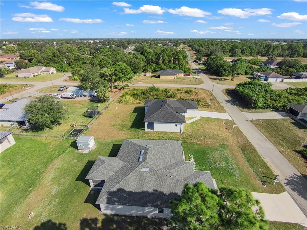 2512 20th Street Southwest Lehigh Acres, FL 33976 - Photo 3 of 48 an aerial view of a house with outdoor space