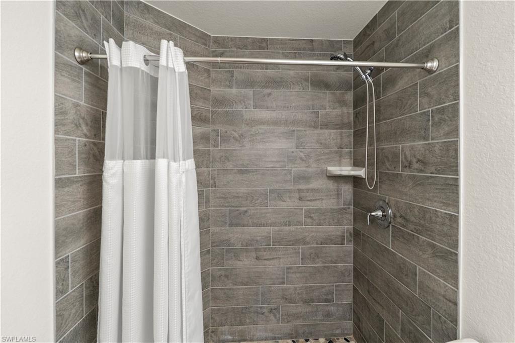 2512 20th Street Southwest Lehigh Acres, FL 33976 - Photo 35 of 48 a bathroom with a shower
