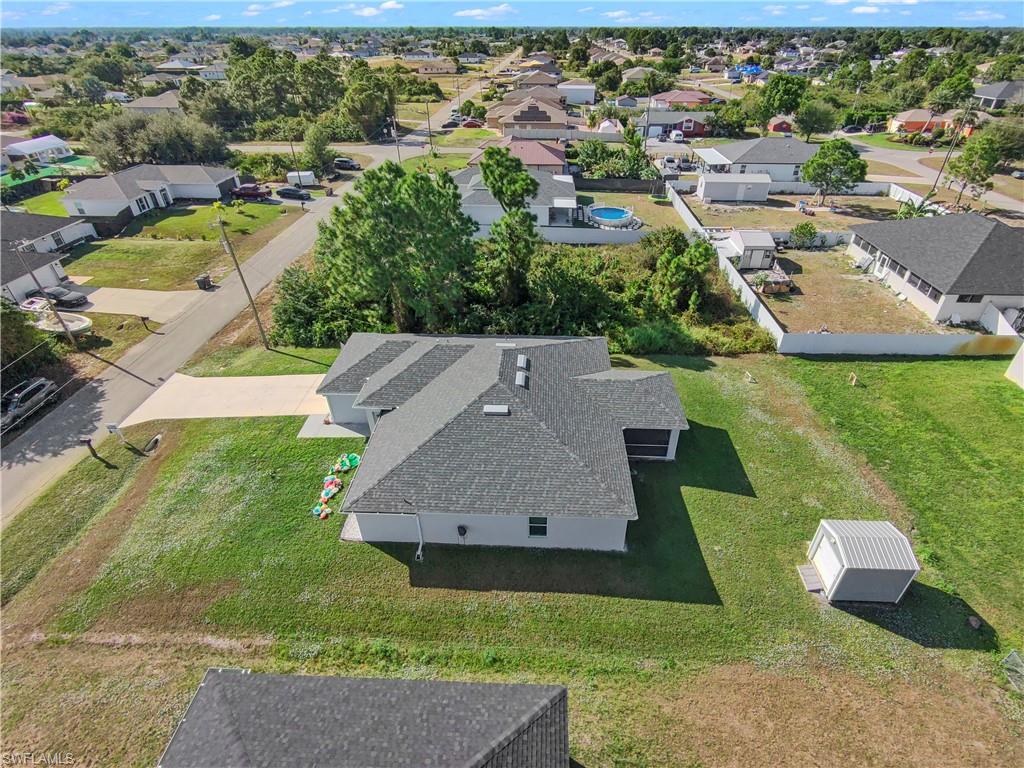 2512 20th Street Southwest Lehigh Acres, FL 33976 - Photo 4 of 48 an aerial view of a house