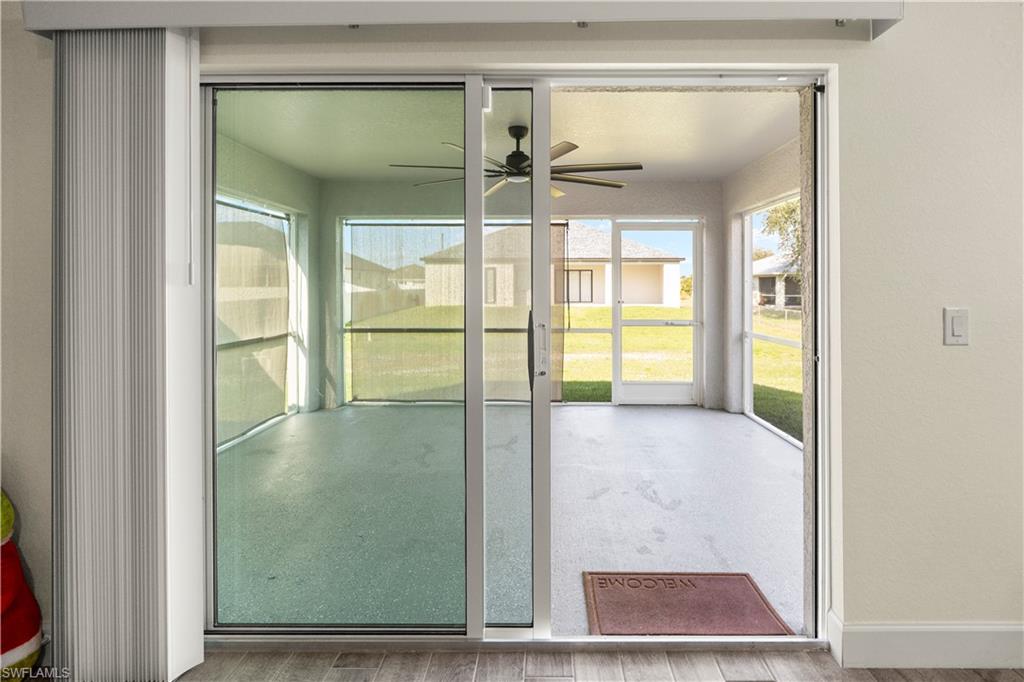 2512 20th Street Southwest Lehigh Acres, FL 33976 - Photo 40 of 48 a view of a glass door with a glass door and a window