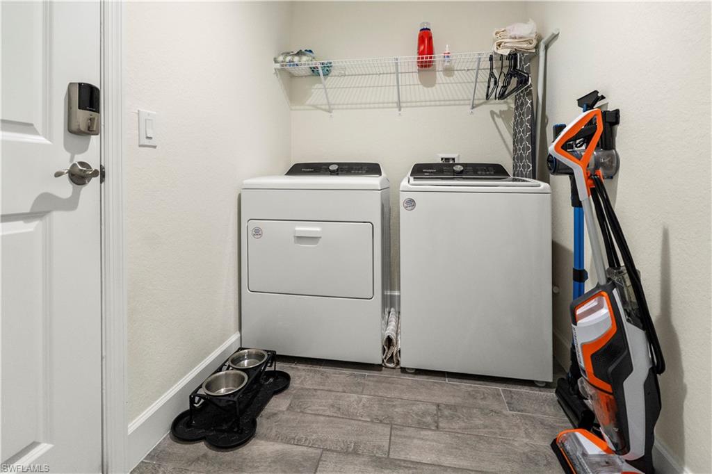 2512 20th Street Southwest Lehigh Acres, FL 33976 - Photo 45 of 48 a utility room with dryer and washer