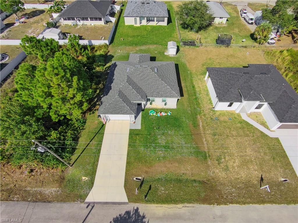 2512 20th Street Southwest Lehigh Acres, FL 33976 - Photo 6 of 48 an aerial view of a house with outdoor space