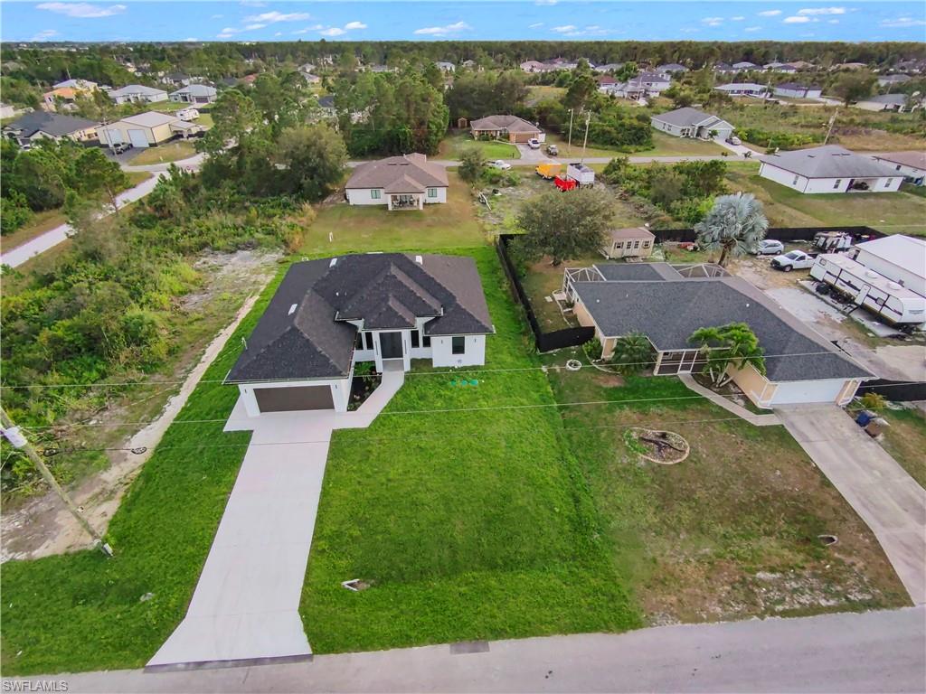2512 20th Street Southwest Lehigh Acres, FL 33976 - Photo 7 of 48 an aerial view of a house