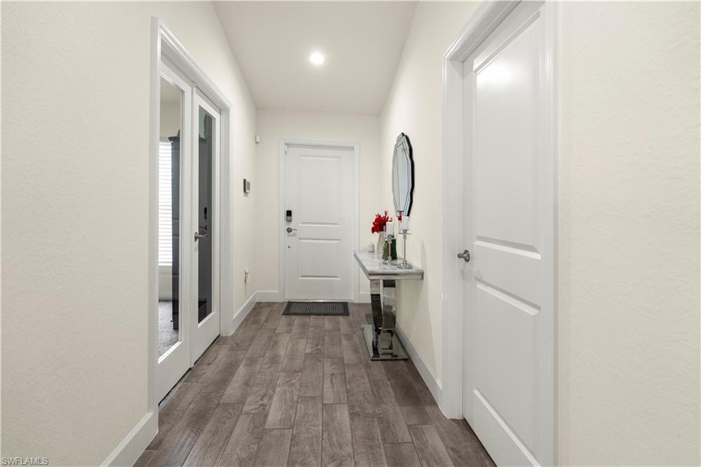 2512 20th Street Southwest Lehigh Acres, FL 33976 - Photo 10 of 48 a view of a livingroom with wooden floor