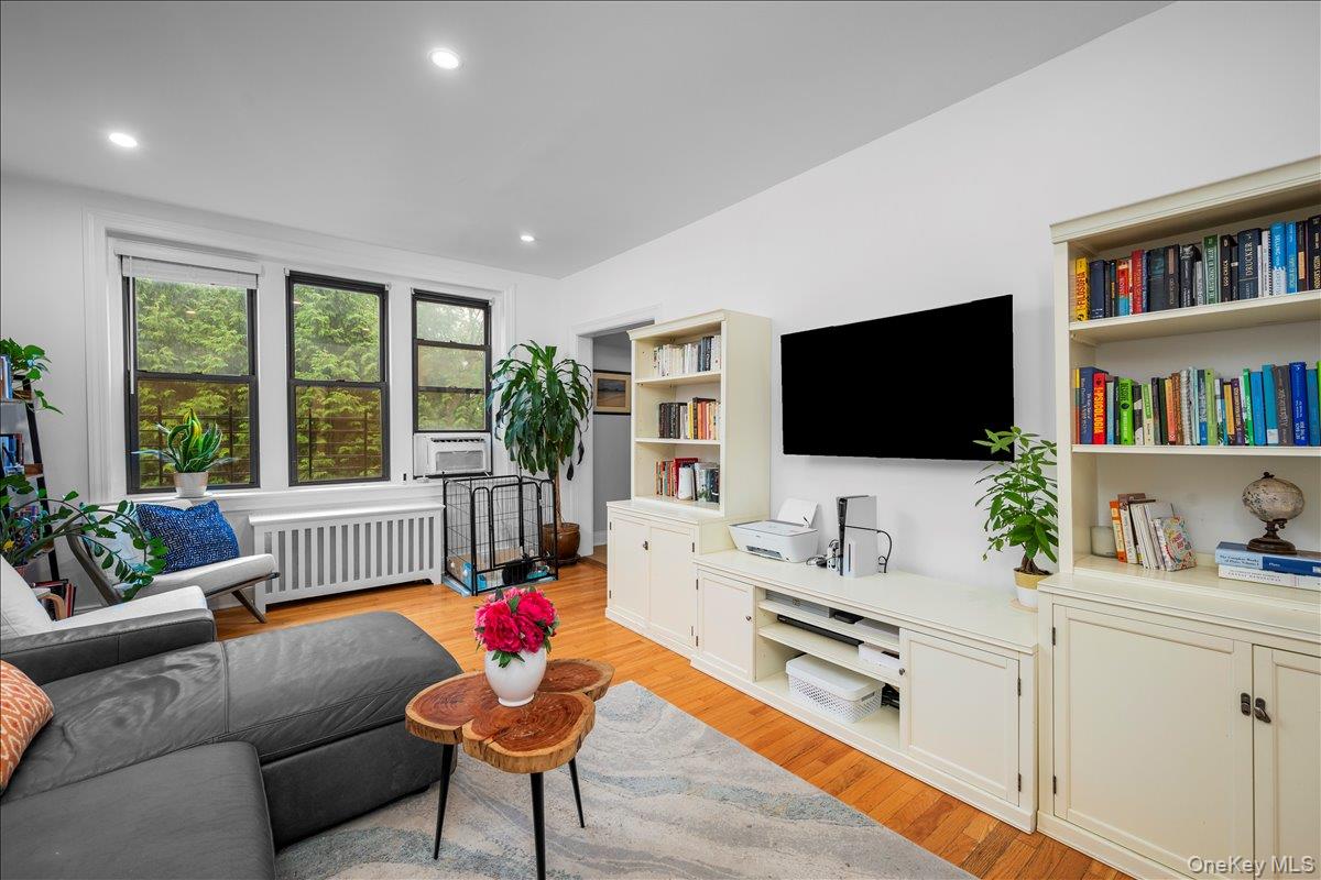 Spacious living room with lots of windows.