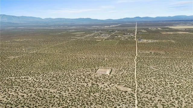 a view of an ocean and a mountain