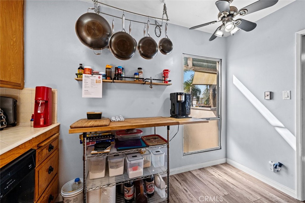 528 Cedar Avenue, Unit 3A Long Beach, CA 90802 - Photo 13 of 46 a kitchen with stainless steel appliances granite countertop a stove and a wooden floor