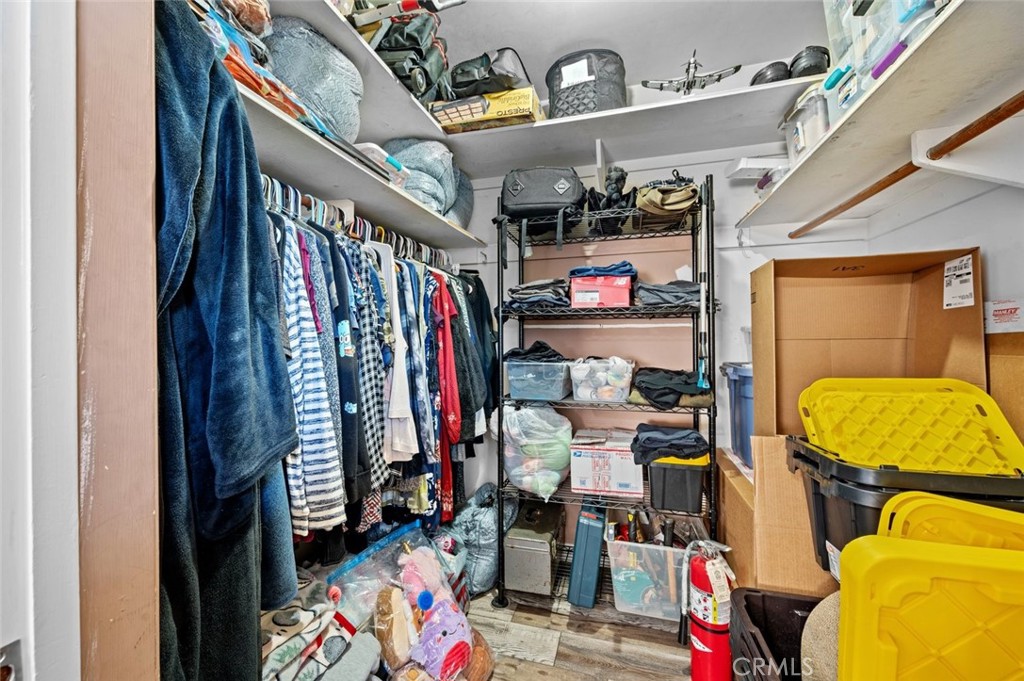 528 Cedar Avenue, Unit 3A Long Beach, CA 90802 - Photo 17 of 46 a view of walk in closet with clothes and shoes