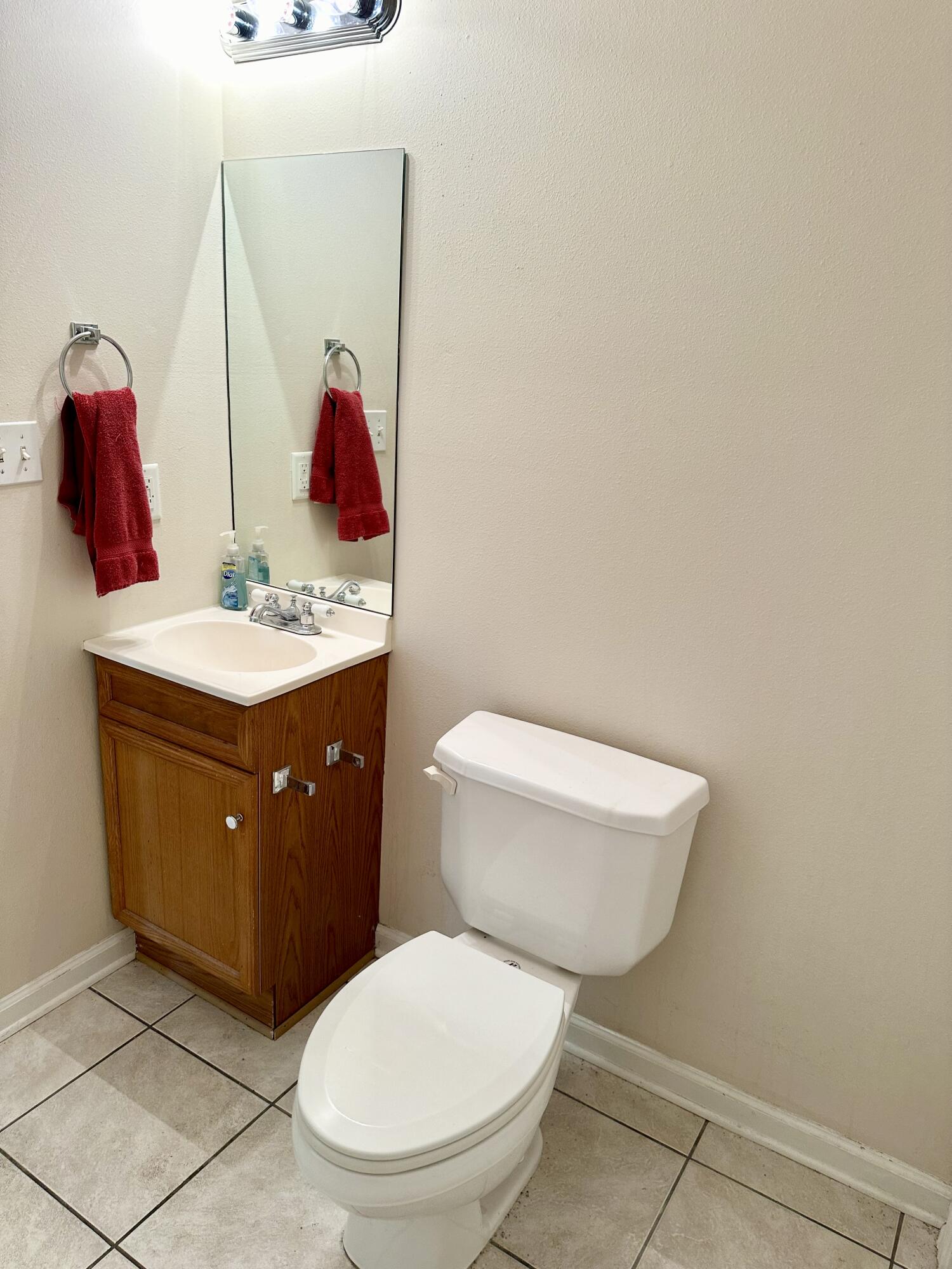 732 East Mack Bayou Drive, Unit 2 Santa Rosa Beach, FL 32459 - Photo 17 of 43 a bathroom with a toilet sink vanity and mirror