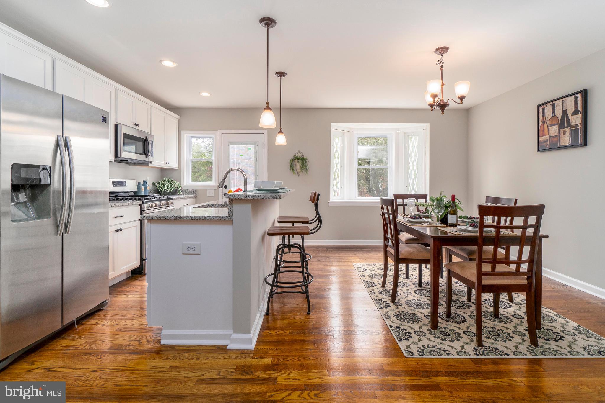 1419 Stonewood Road Baltimore, MD 21239 - Photo 4 of 28 Kitchen With Island & Separate Dining Room