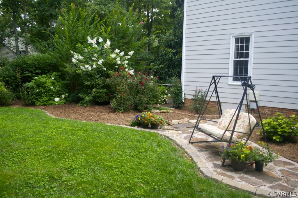 2001 Castlebridge Road Midlothian, VA 23113 - Photo 7 of 21 a view of a chair and table in backyard of the house