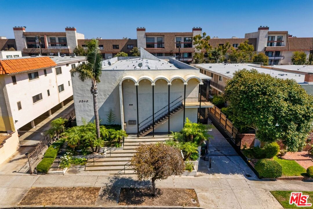 8346 Manitoba Street, Unit 11 Playa del Rey, CA 90293 - Photo 8 of 14 a front view of a building with outdoor space