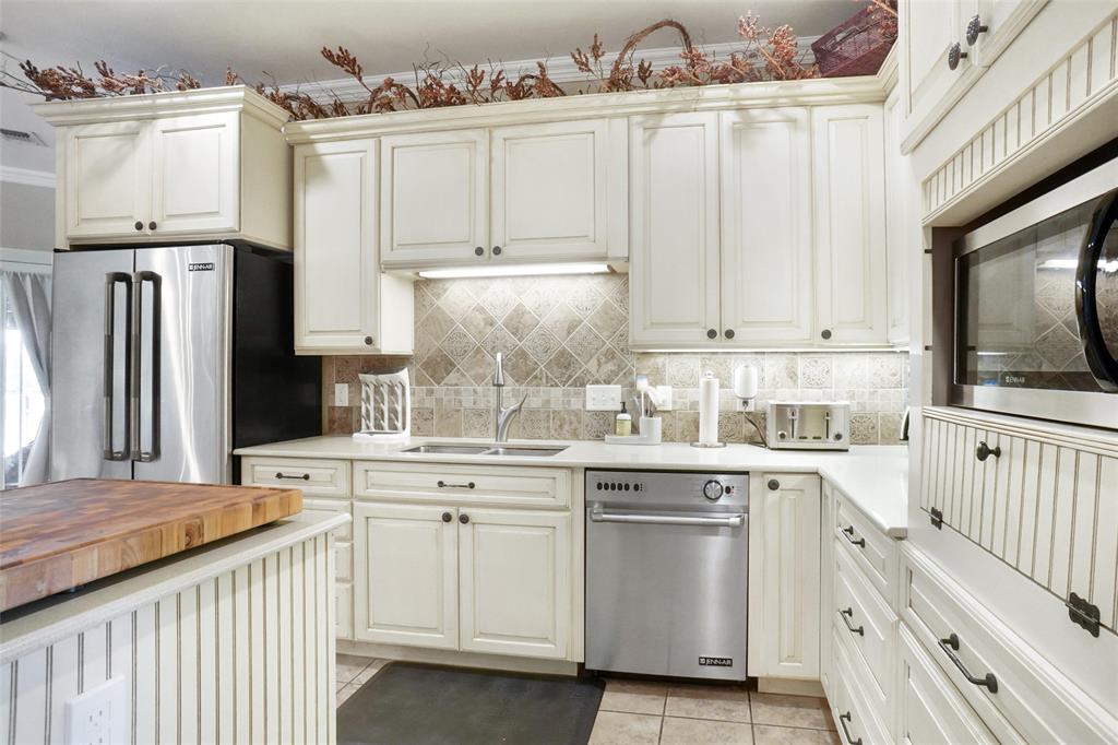 13340 John Day Road Haslet, TX 76052 - Photo 8 of 30 a kitchen with stainless steel appliances granite countertop a sink and cabinets