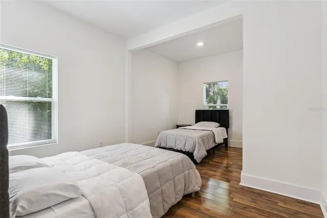 a bedroom with a bed and cabinets