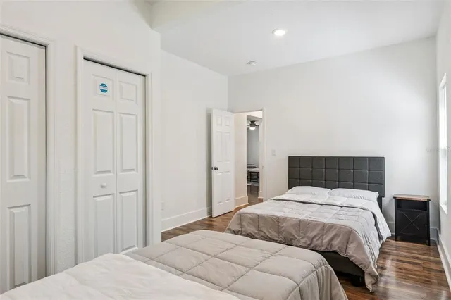 a bedroom with a bed and a dresser