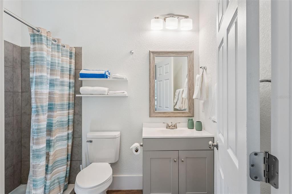 145 Ruth Avenue Cocoa, FL 32922 - Photo 16 of 23 a bathroom with a sink a toilet and shower