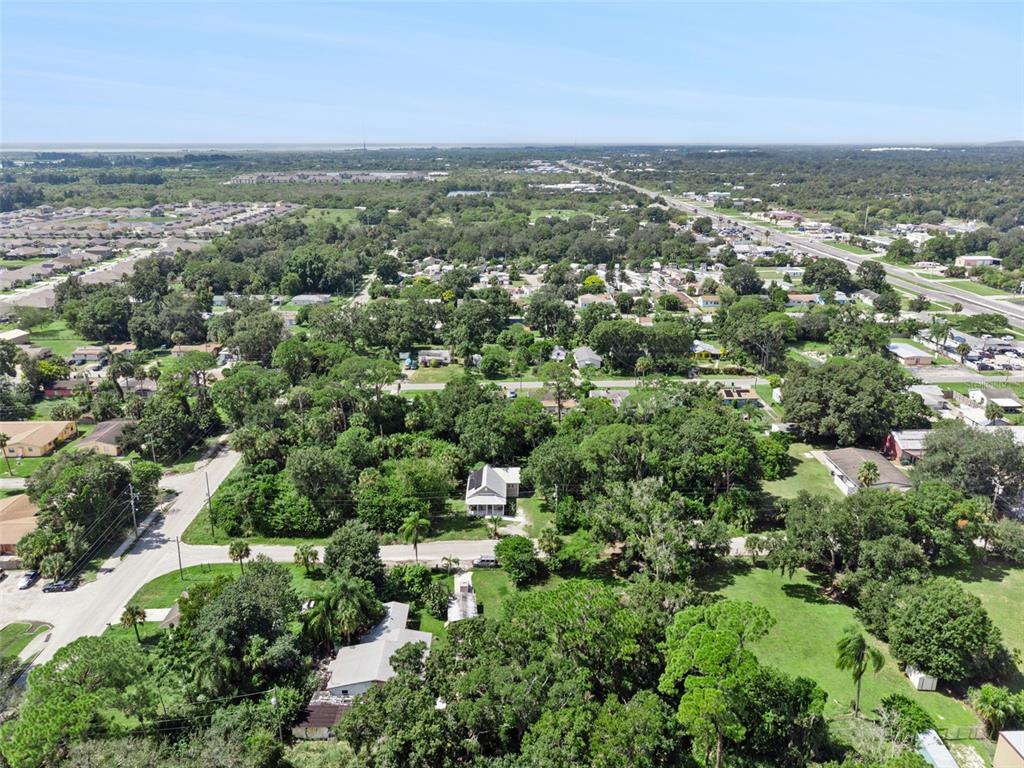145 Ruth Avenue Cocoa, FL 32922 - Photo 22 of 23 an aerial view of residential houses with outdoor space and trees