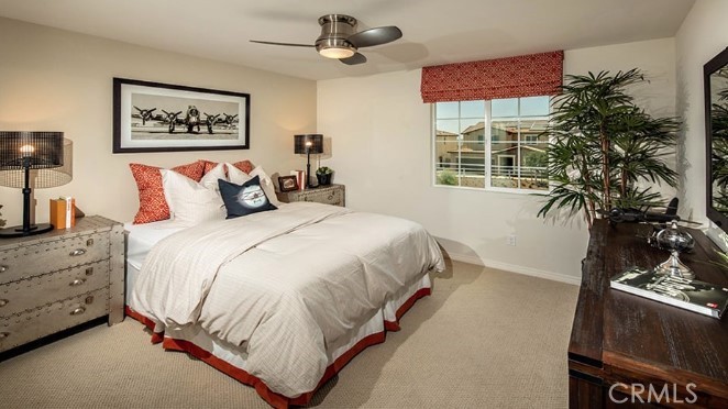 14080 Versimo Lane Beaumont, CA 92223 - Photo 18 of 20 a bed room with a bed and a painting on the wall