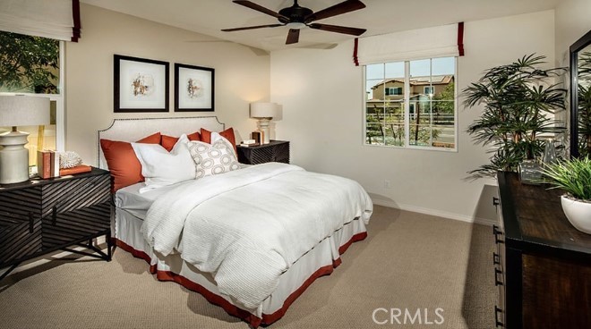 14080 Versimo Lane Beaumont, CA 92223 - Photo 10 of 20 a bedroom with a bed and a window