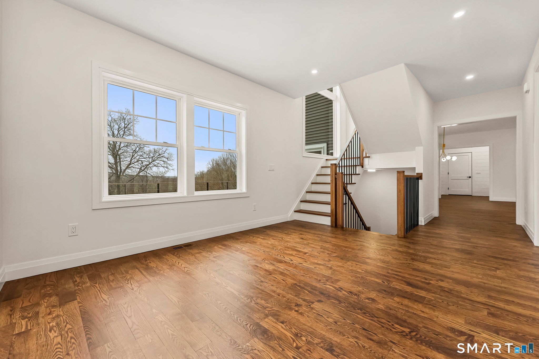 41 Crown View Drive Monroe, CT 06468 - Photo 11 of 41 a view of empty room with wooden floor and window