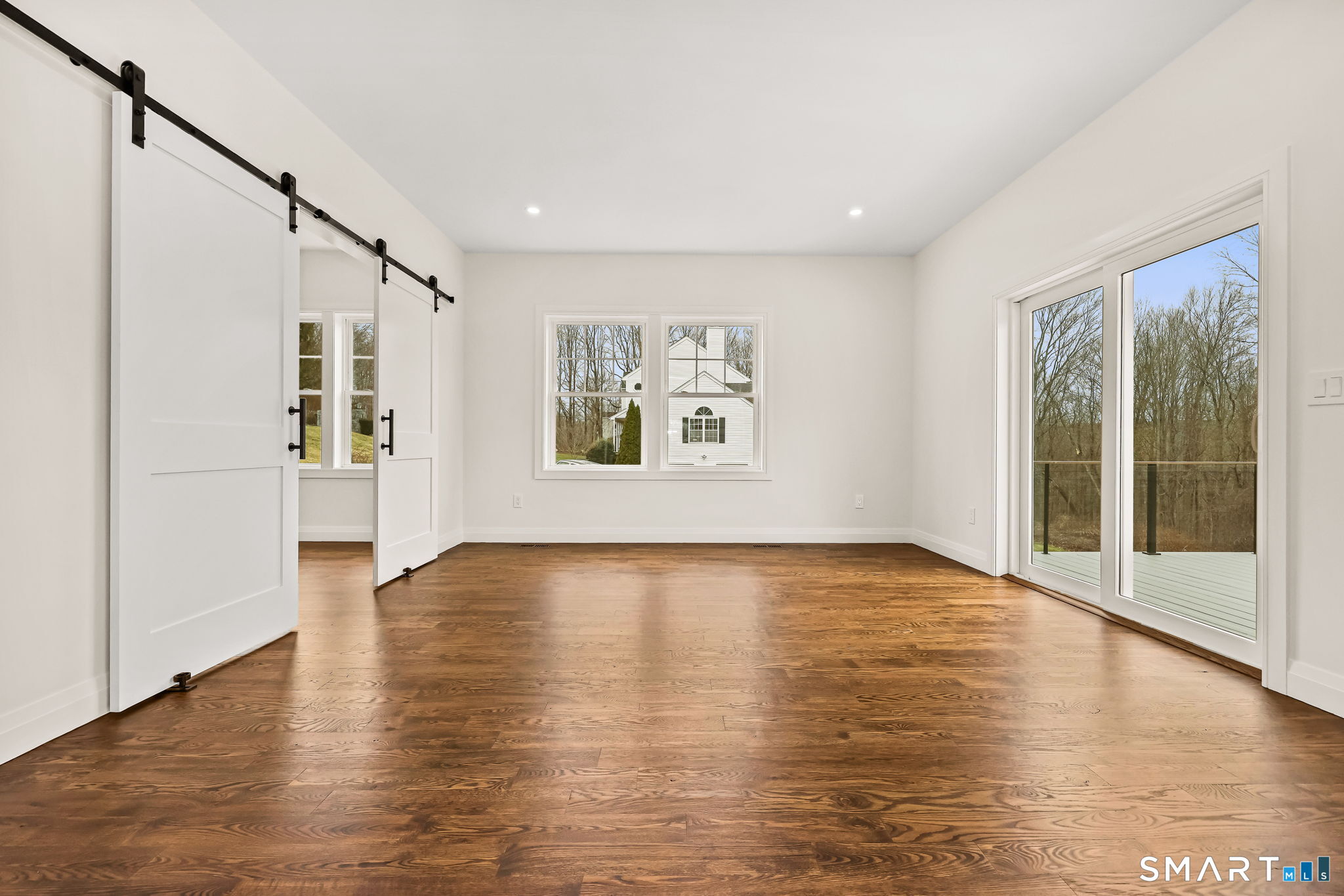 41 Crown View Drive Monroe, CT 06468 - Photo 12 of 41 a view of an empty room with wooden floor and a window