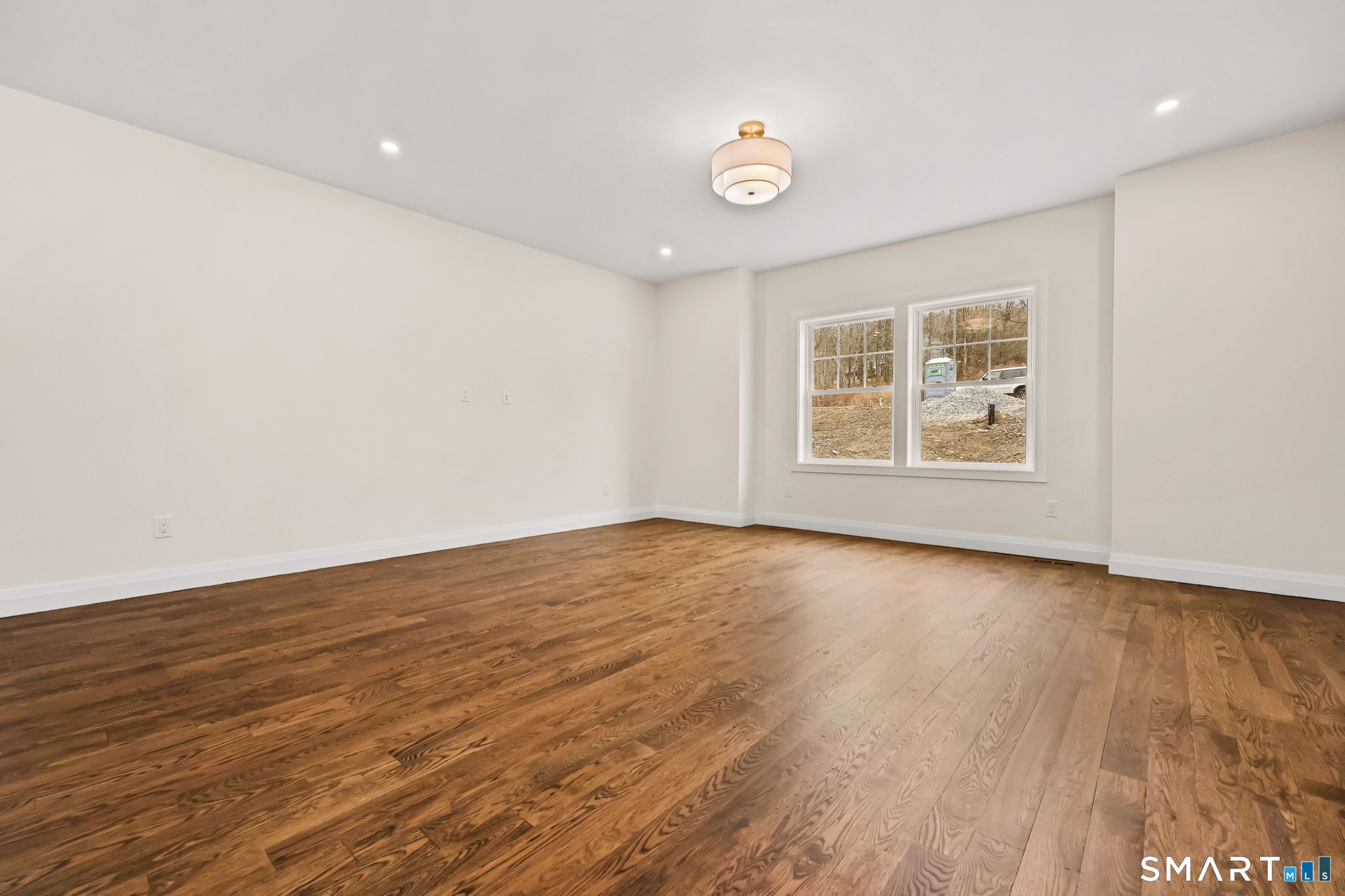 41 Crown View Drive Monroe, CT 06468 - Photo 16 of 41 an empty room with wooden floor and windows
