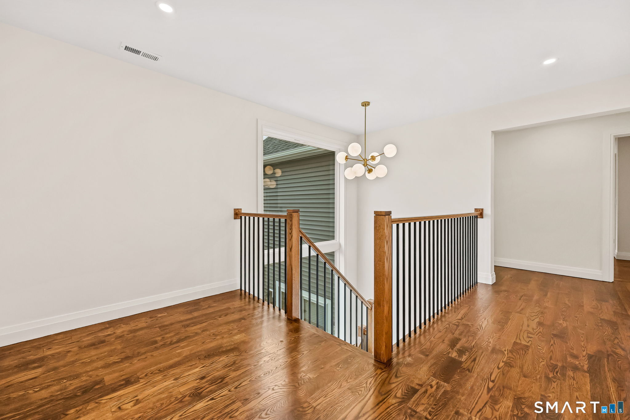 41 Crown View Drive Monroe, CT 06468 - Photo 20 of 41 a view of a room with wooden floor and staircase
