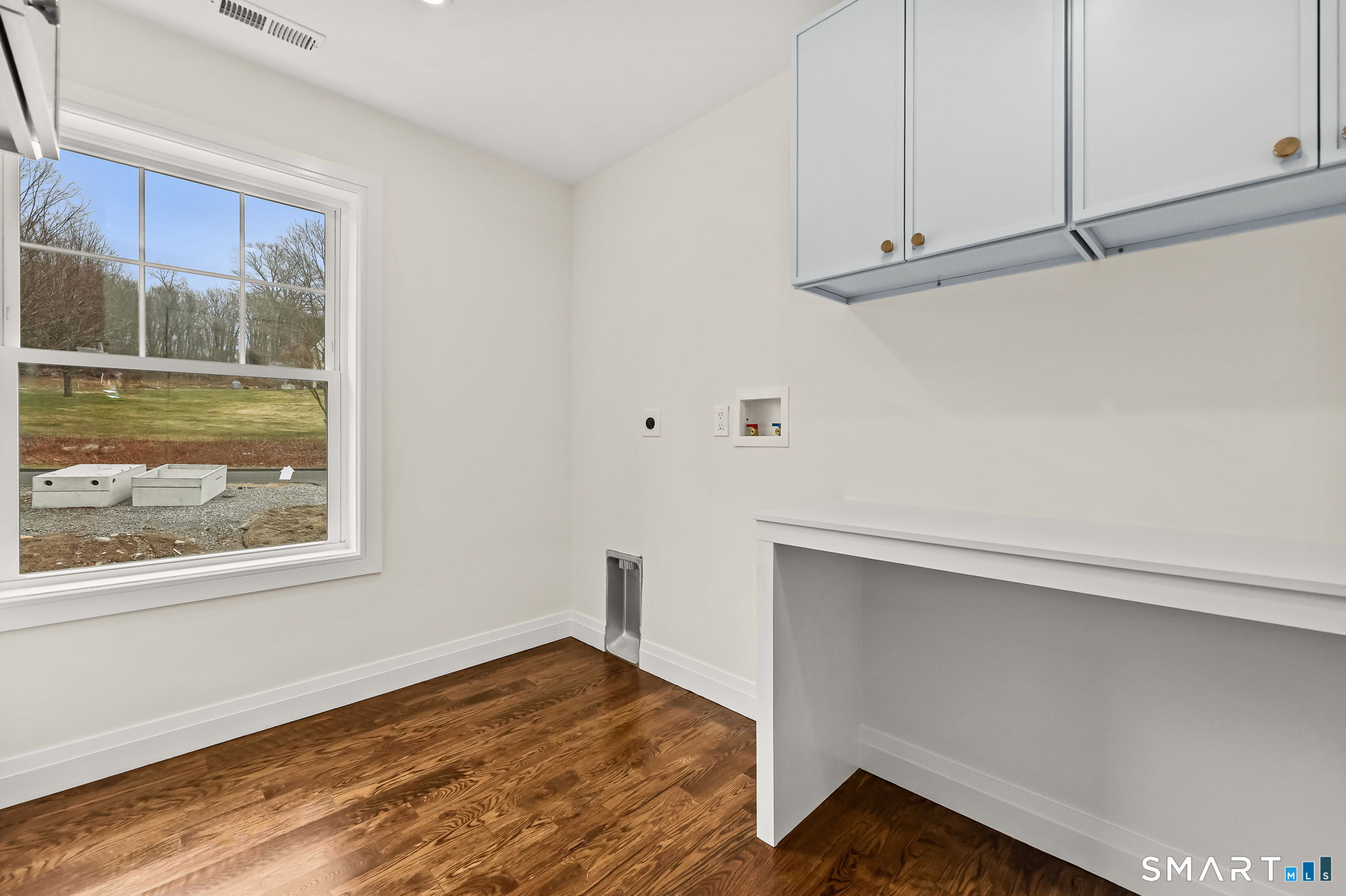 41 Crown View Drive Monroe, CT 06468 - Photo 21 of 41 a view of an empty room with a window and wooden floor
