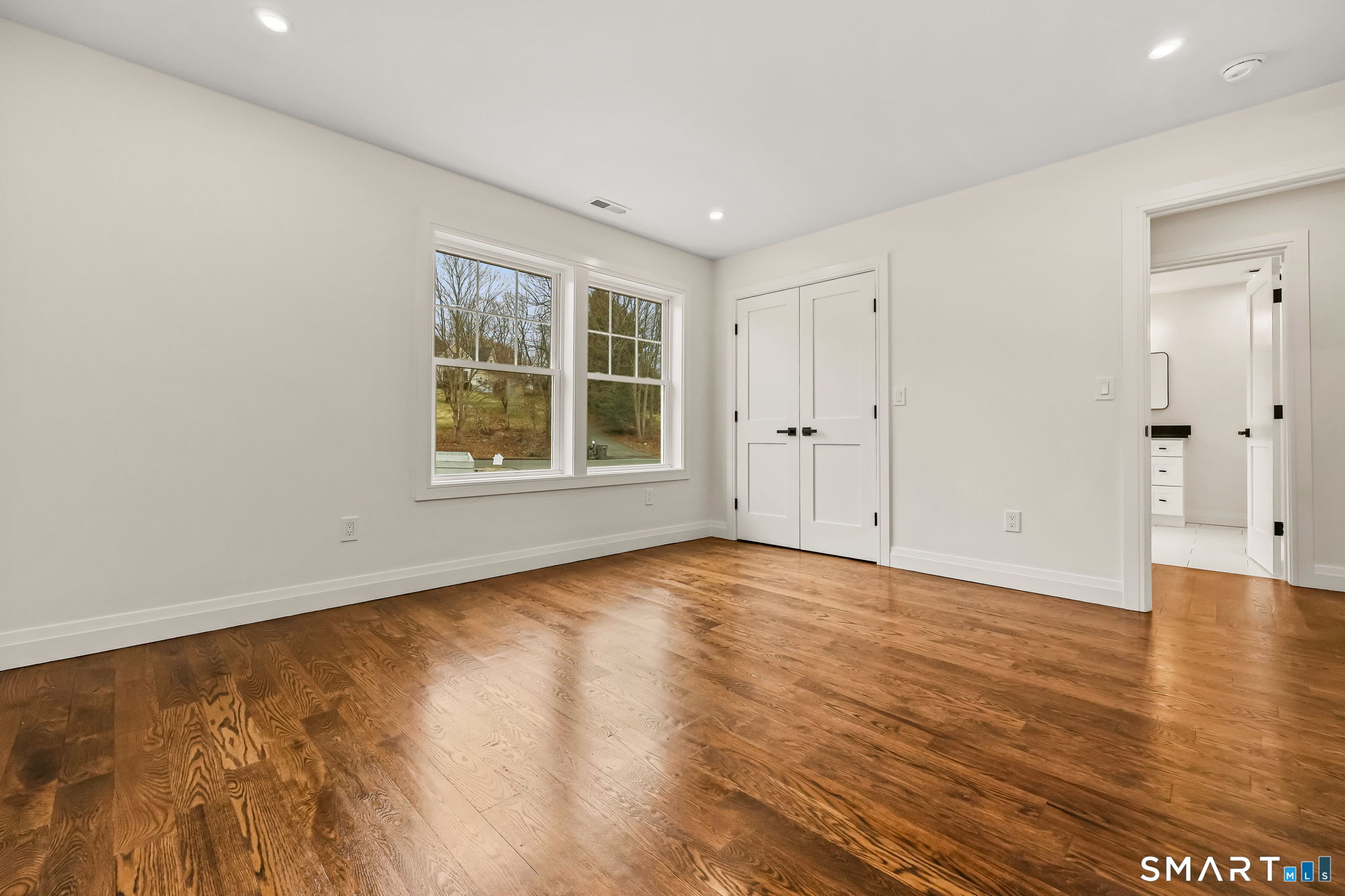 41 Crown View Drive Monroe, CT 06468 - Photo 22 of 41 a view of an empty room with wooden floor and windows