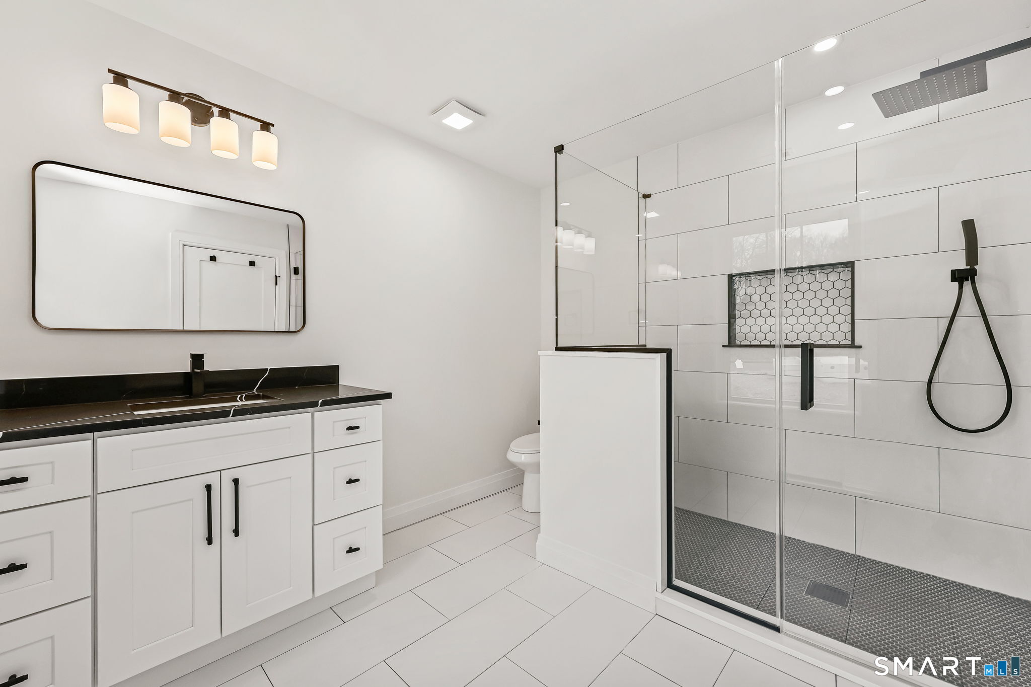 41 Crown View Drive Monroe, CT 06468 - Photo 24 of 41 a bathroom with a double vanity sink mirror and toilet