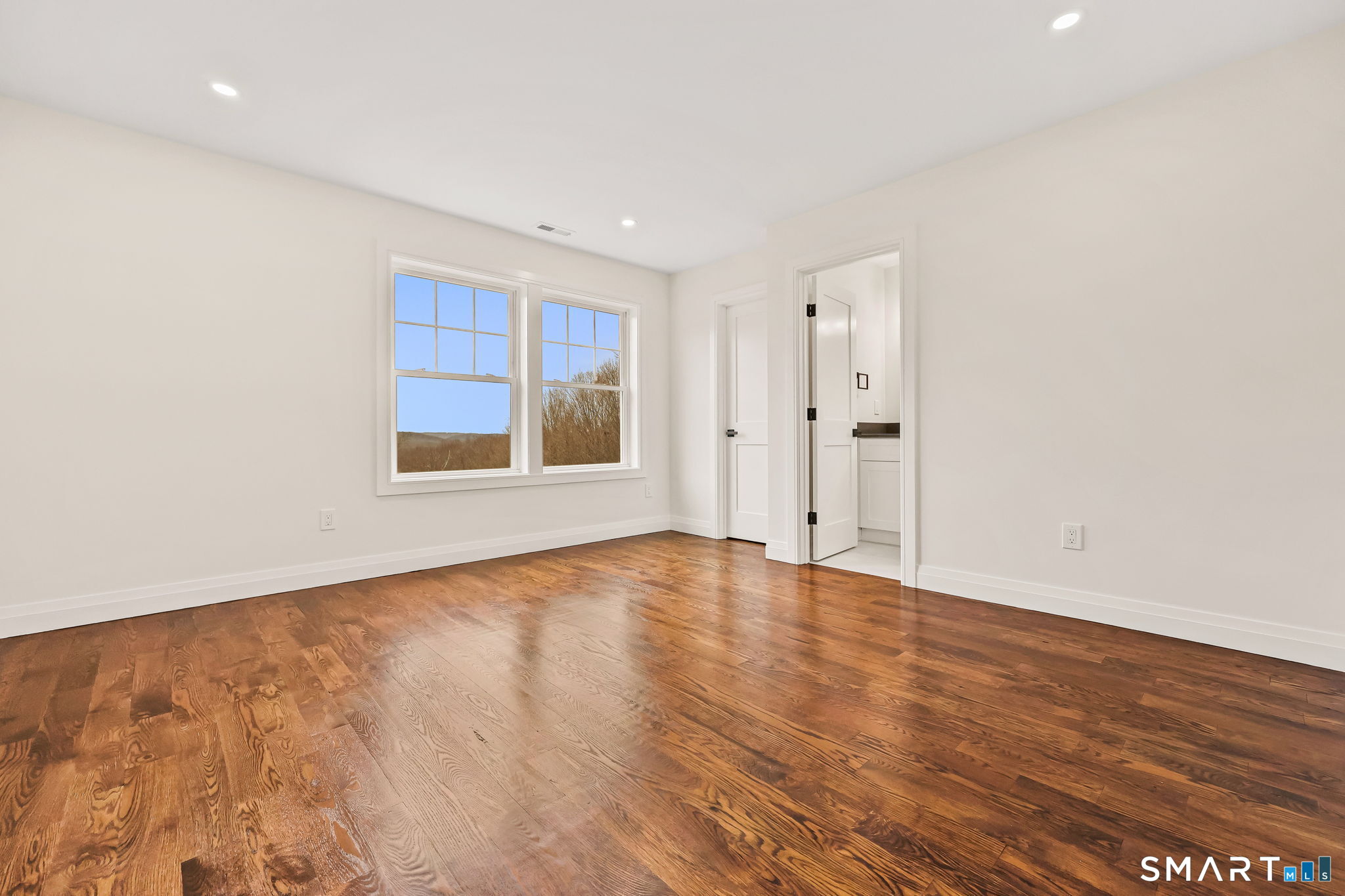 41 Crown View Drive Monroe, CT 06468 - Photo 26 of 41 a view of an empty room with wooden floor and windows