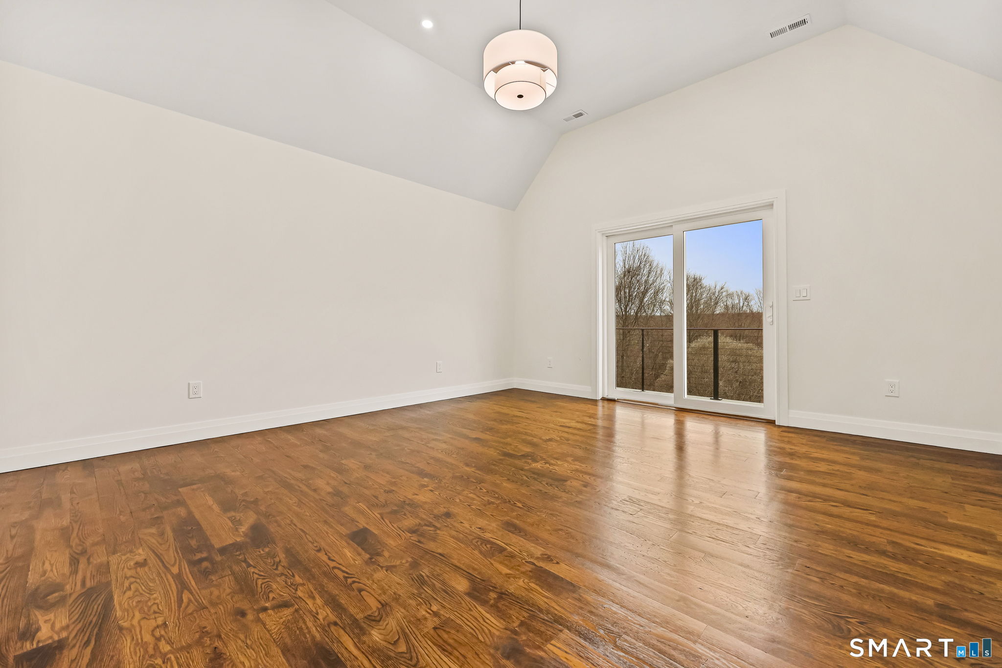 41 Crown View Drive Monroe, CT 06468 - Photo 33 of 41 a view of an empty room with wooden floor and a window