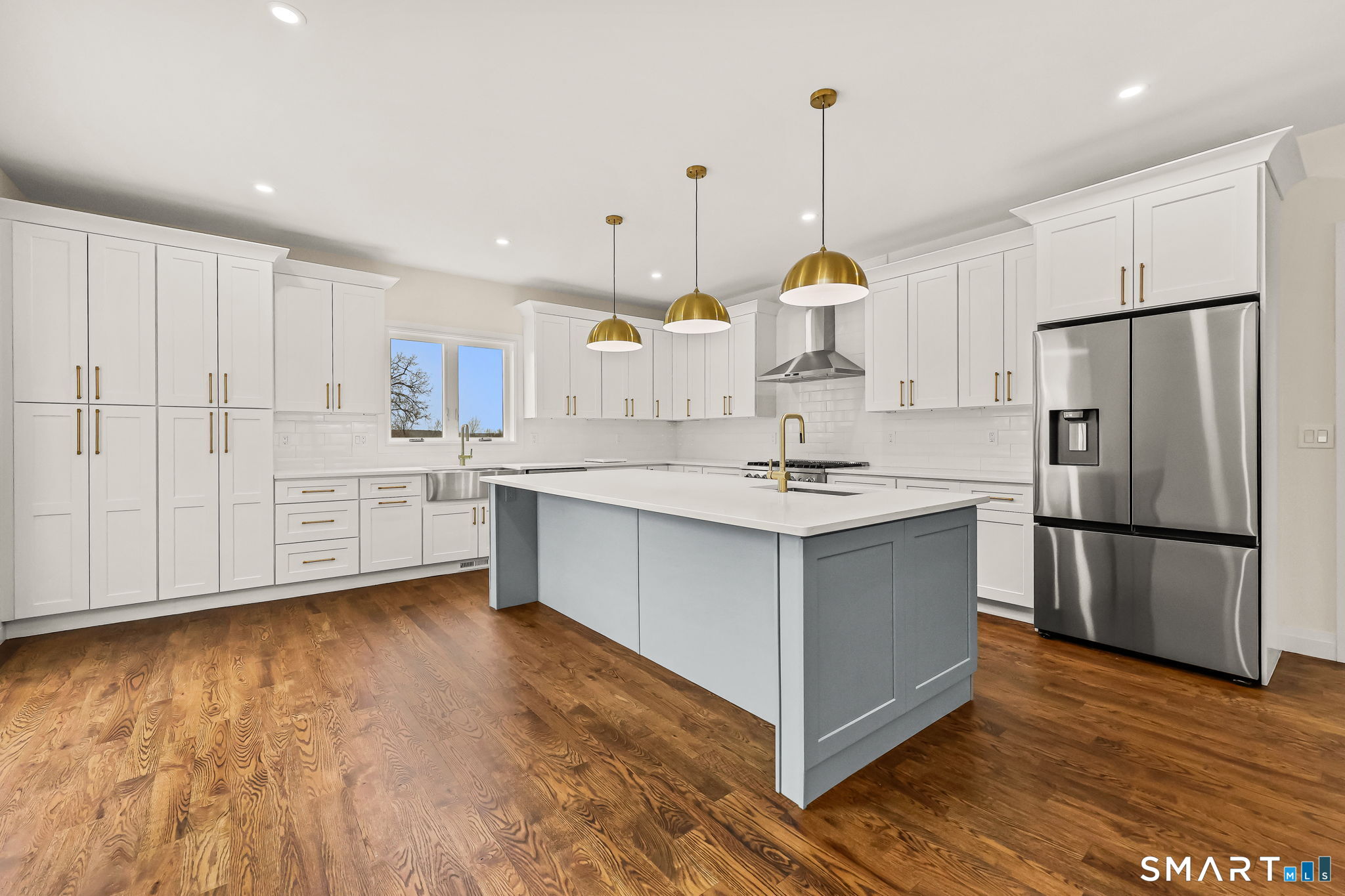 41 Crown View Drive Monroe, CT 06468 - Photo 4 of 41 a kitchen with kitchen island white cabinets and stainless steel appliances