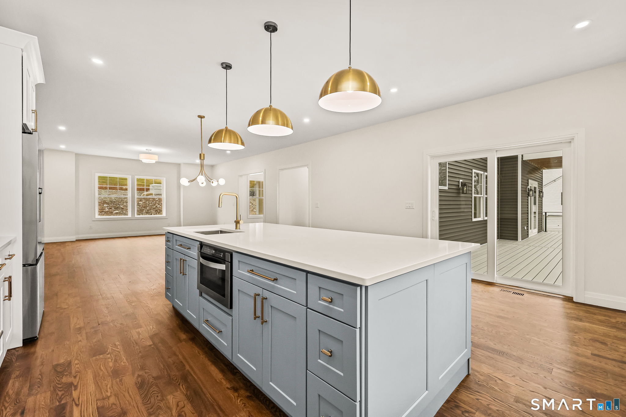 41 Crown View Drive Monroe, CT 06468 - Photo 8 of 41 a kitchen with a stove kitchen island and a wooden floor