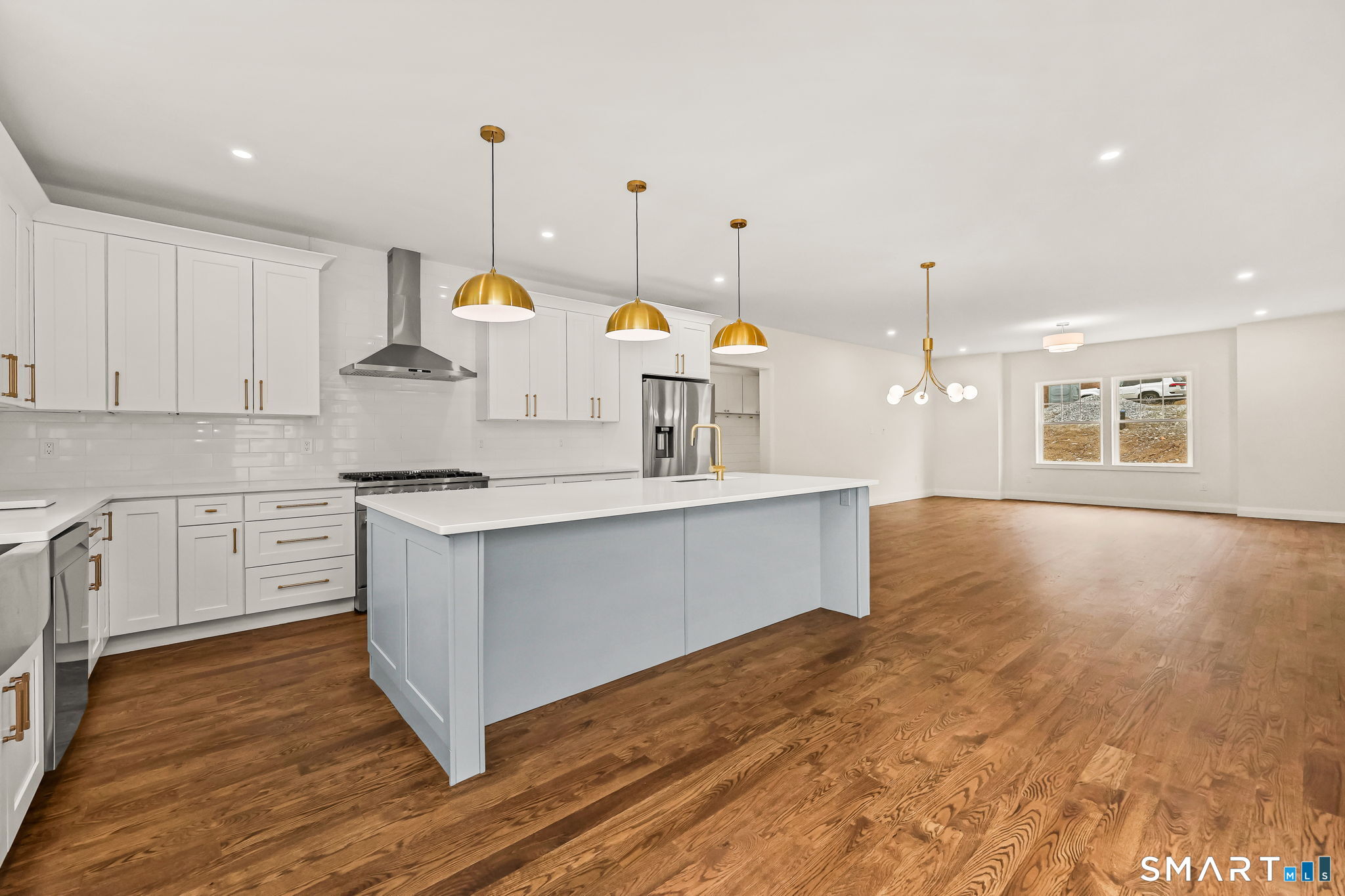 41 Crown View Drive Monroe, CT 06468 - Photo 9 of 41 a kitchen with wooden floors and white appliances