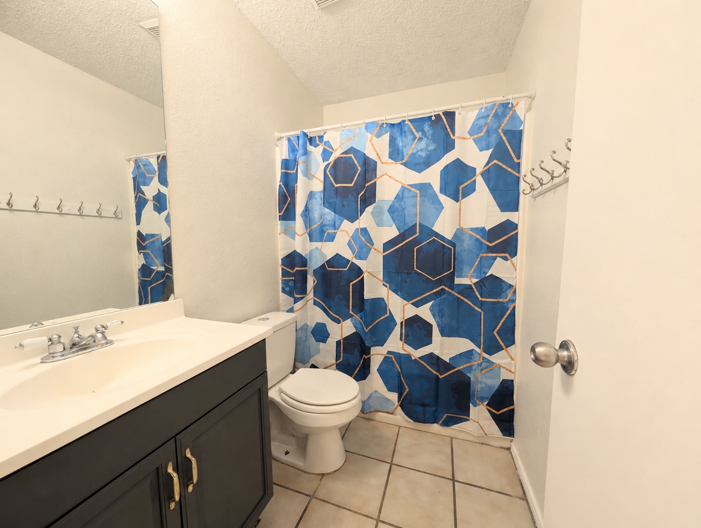 2016 Redwing Way Round Rock, TX 78664 - Photo 12 of 19 Guest Bathroom:
Functional full bathroom with tiled flooring and ample vanity storage.