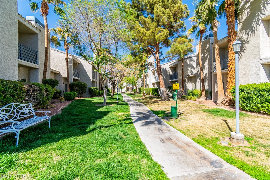 6250 West Flamingo Road, Unit 98 Las Vegas, NV 89103 - Photo 39 of 40 Surrounding community featuring a lawn and a residential view