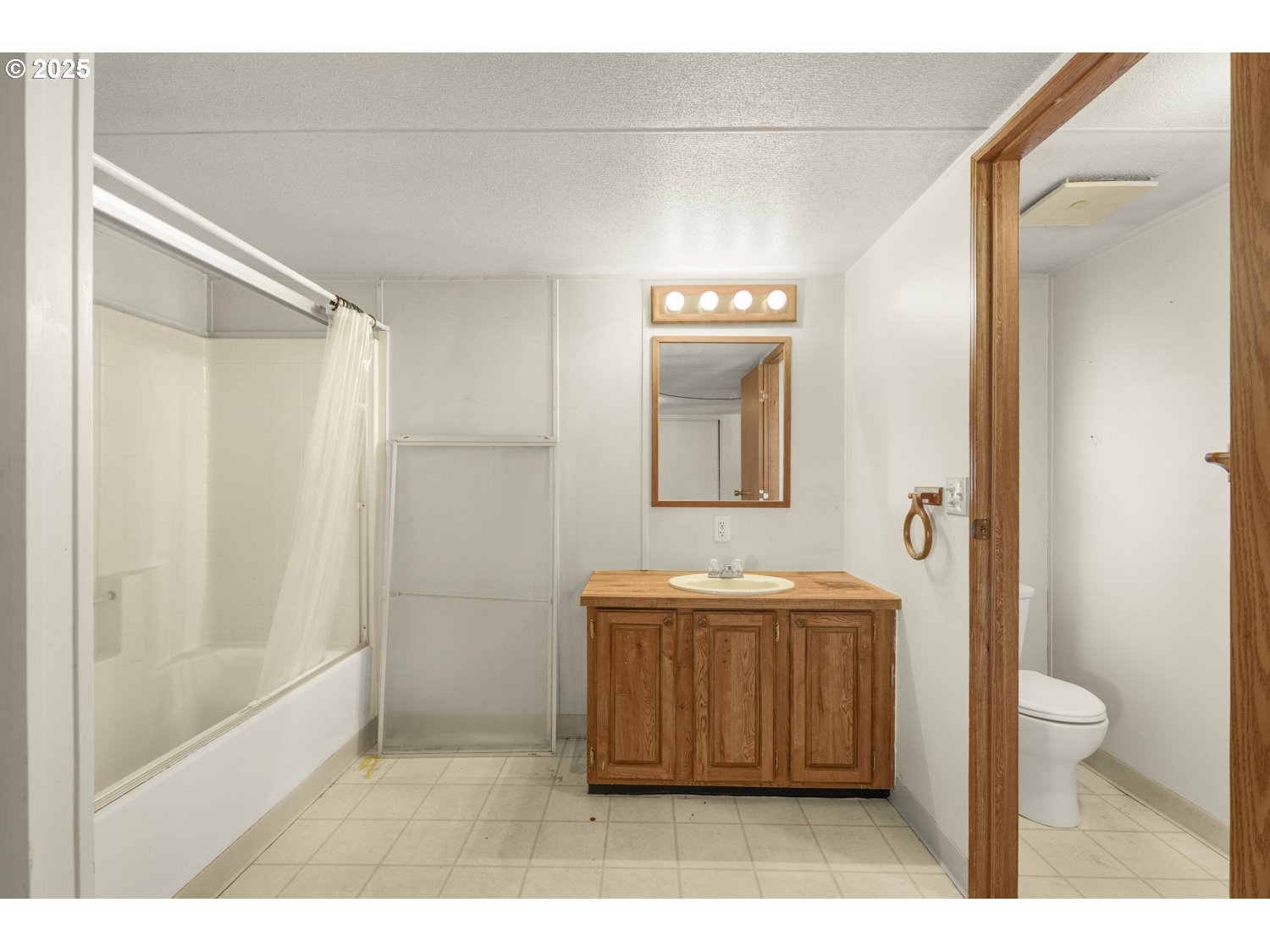 1500 Gabriela Court Northeast, Unit 27 Salem, OR 97301 - Photo 11 of 21 a bathroom with a sink a toilet and shower