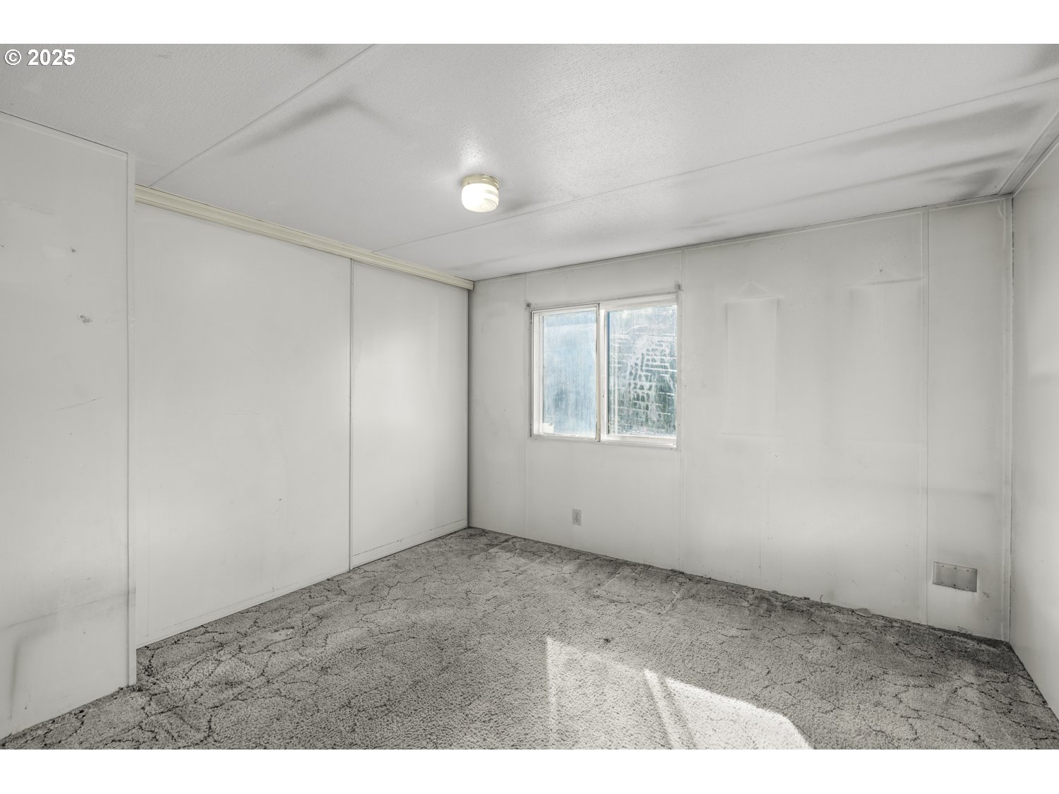 1500 Gabriela Court Northeast, Unit 27 Salem, OR 97301 - Photo 12 of 21 a view of an empty room with a window