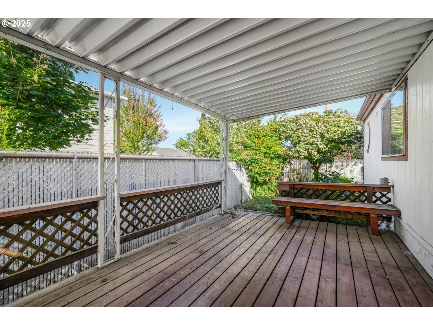 1500 Gabriela Court Northeast, Unit 27 Salem, OR 97301 - Photo 2 of 21 a view of balcony with wooden floor and outdoor seating