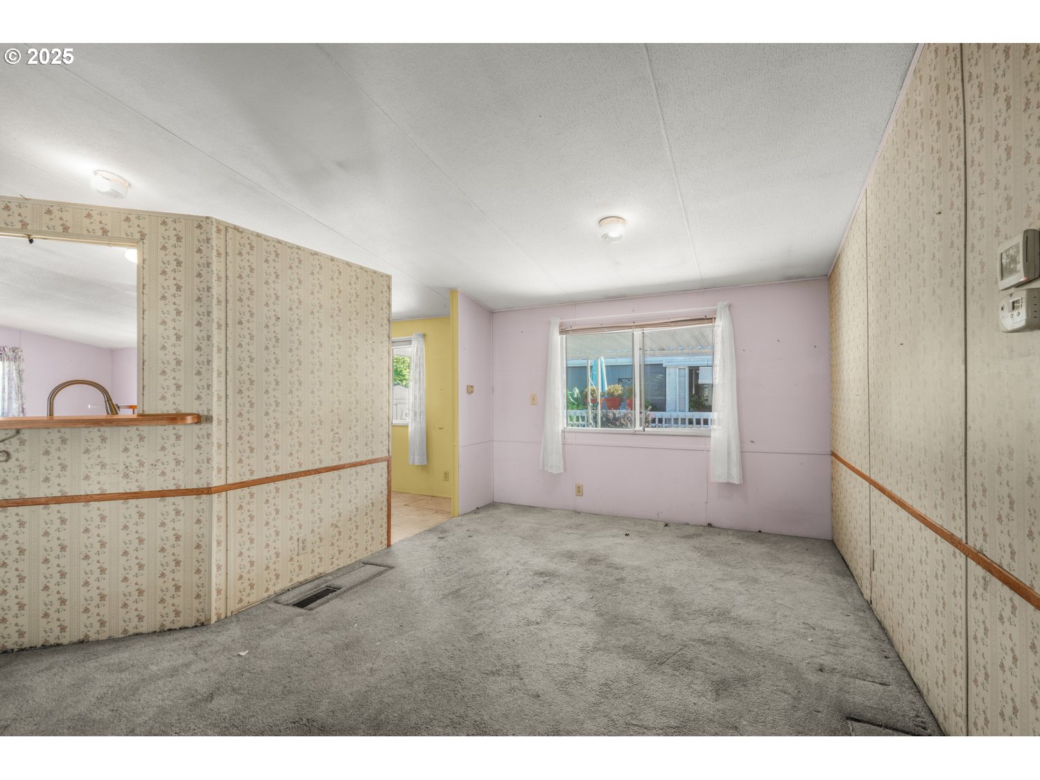 1500 Gabriela Court Northeast, Unit 27 Salem, OR 97301 - Photo 4 of 21 a view of an empty room with a window