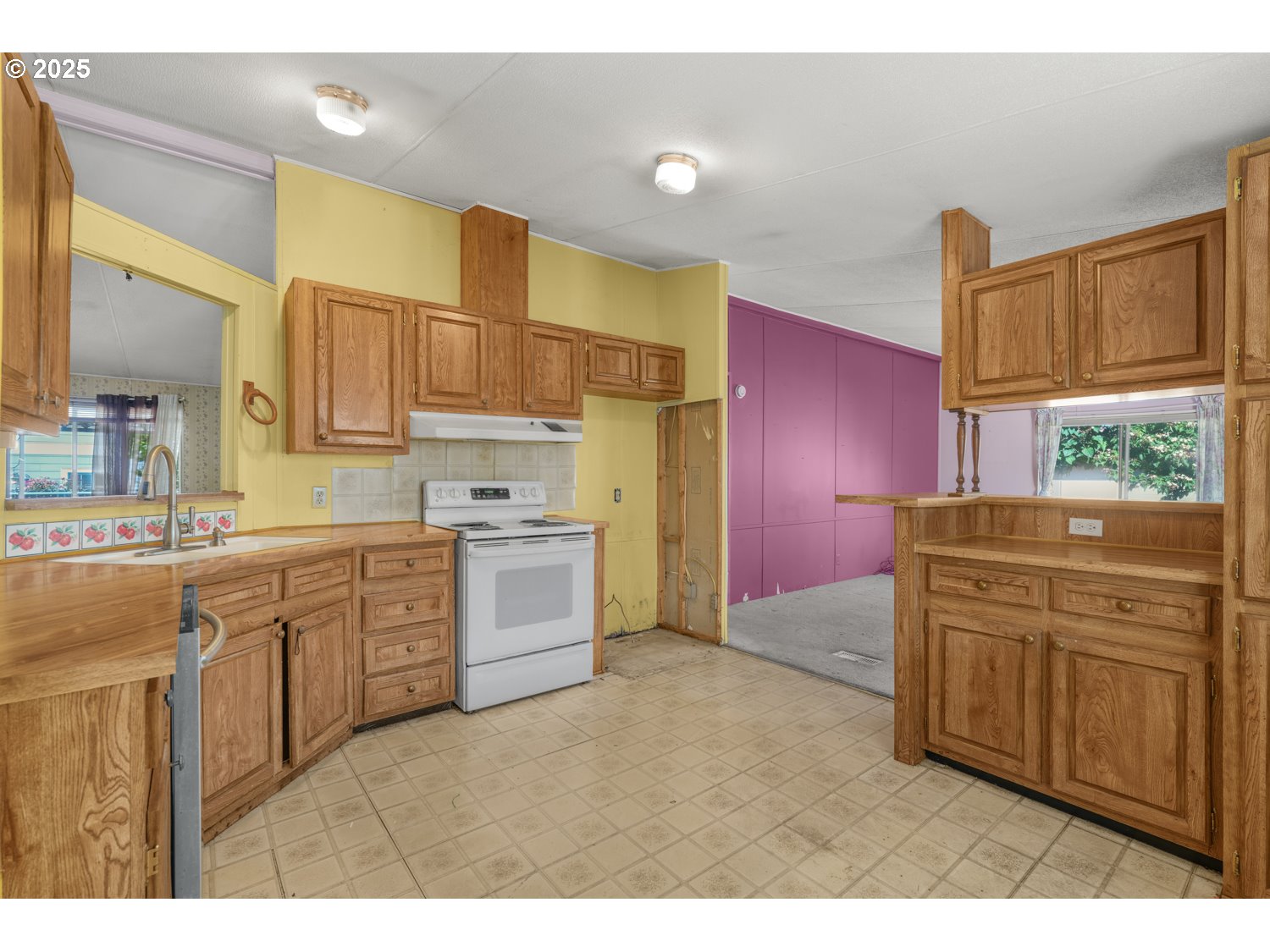 1500 Gabriela Court Northeast, Unit 27 Salem, OR 97301 - Photo 5 of 21 a kitchen with granite countertop a sink cabinets stainless steel appliances and a window